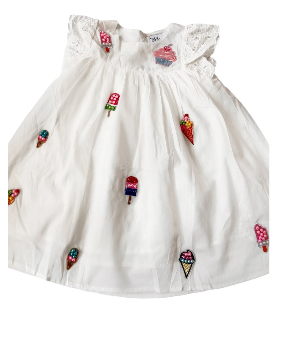 All about The Beaded Cream Ruffle Dress